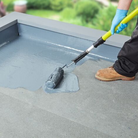 Professional waterproofing being applied to a flat roof